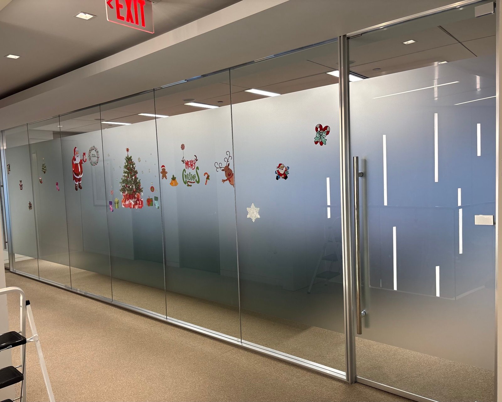 Gradient frosted privacy film on a glass office wall