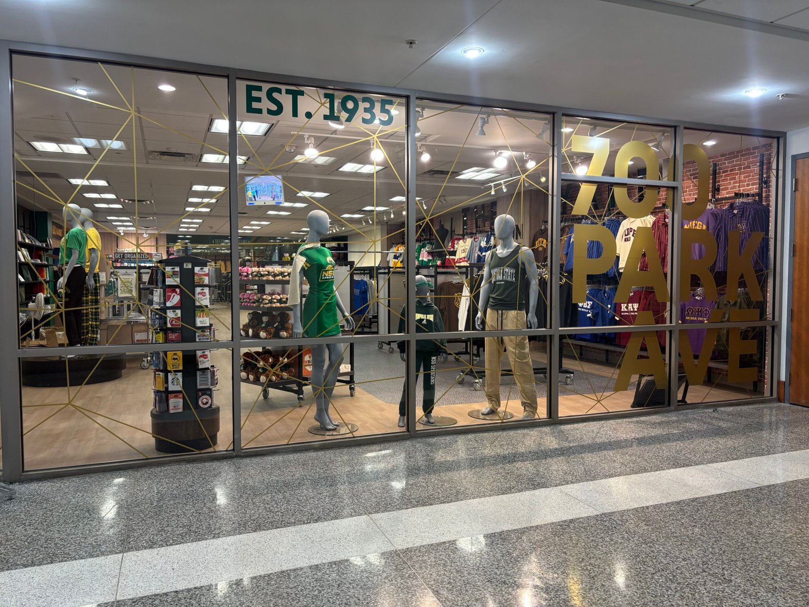 Norfolk State University bookstore window graphics with gold lettering