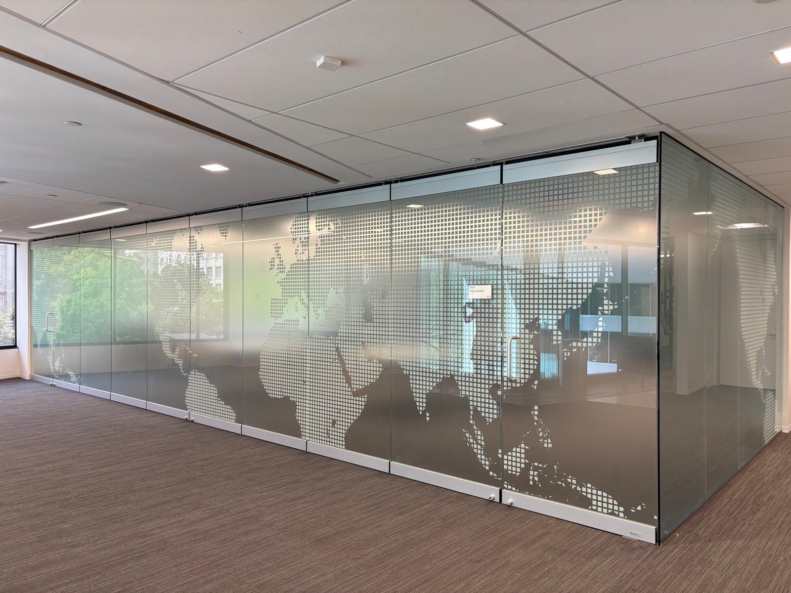 World map privacy film on a glass conference room